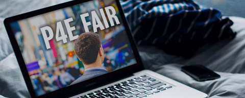 Laptop on bed with words P4E Fair on it