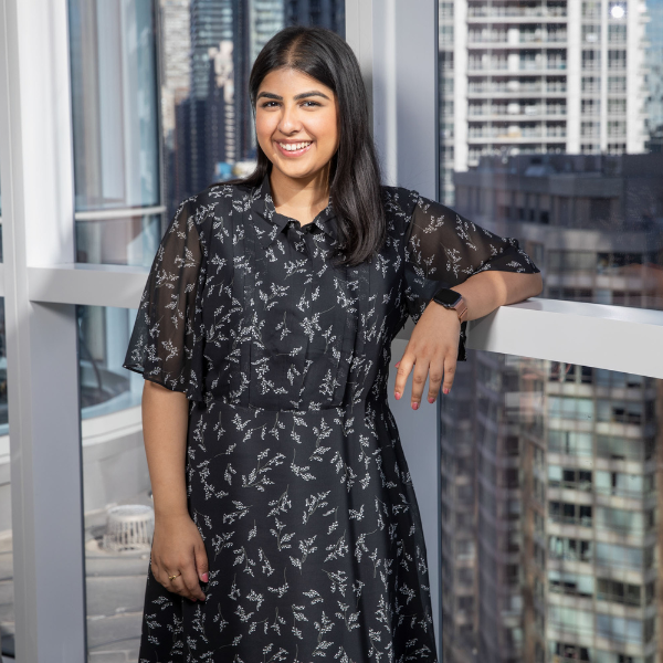 student headshot wearing a bllack dress and long black hair