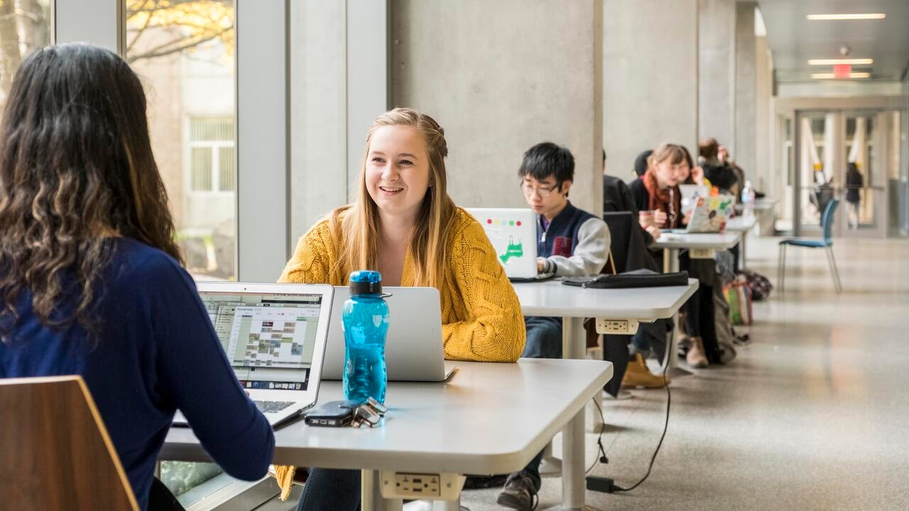 Students sitting in a lounge area