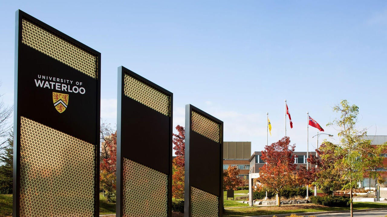 Signs outside the entrance to UW campus